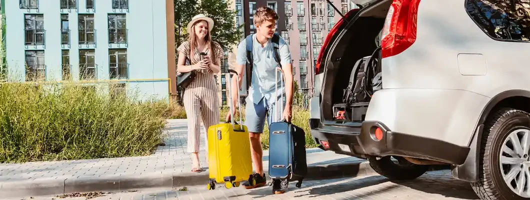 Couple gathering for road trip. Rental Car Insurance: Is It Worth It? 