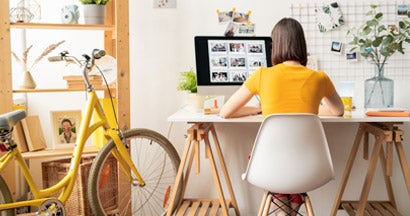 Woman working from a home office.  Does a Non-Risky Business Need Business Insurance?