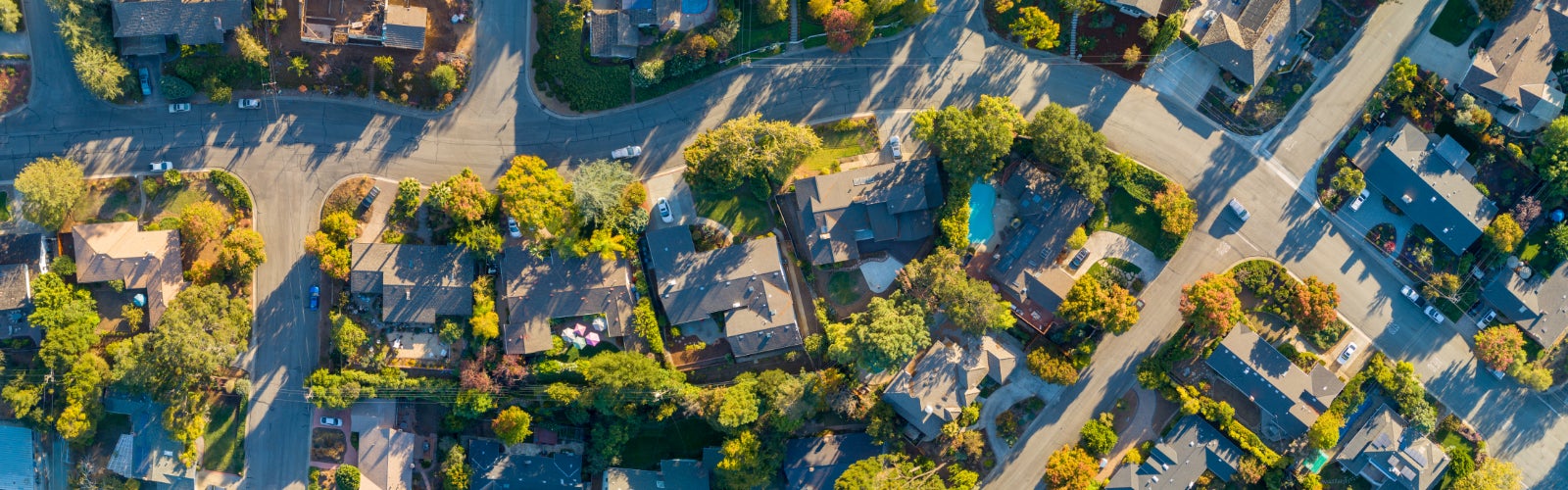 Aerial view of a modern houses in a new housing development. What is an independent agent?