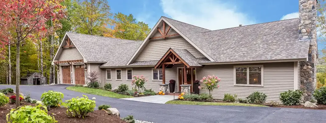 Large circular asphalt driveway in front of home. Madison, South Dakota Homeowners Insurance.