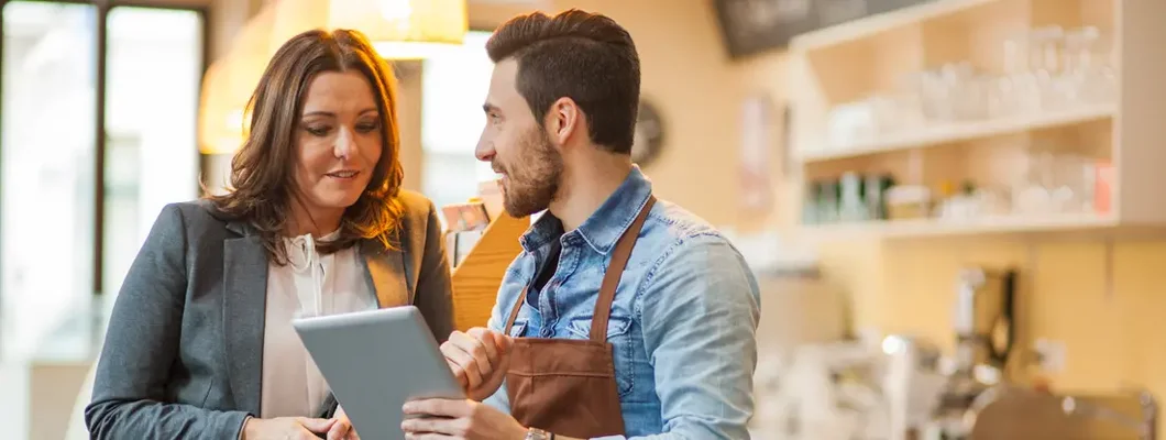 Owner and bar tender going through daily tasks. Find Tempe, Arizona business insurance.