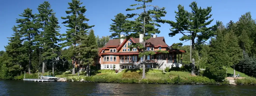 Lakefront Property on Sunny Day of Summer.  How to Find the Best Homeowners Insurance in Lake Ozark, Missouri.