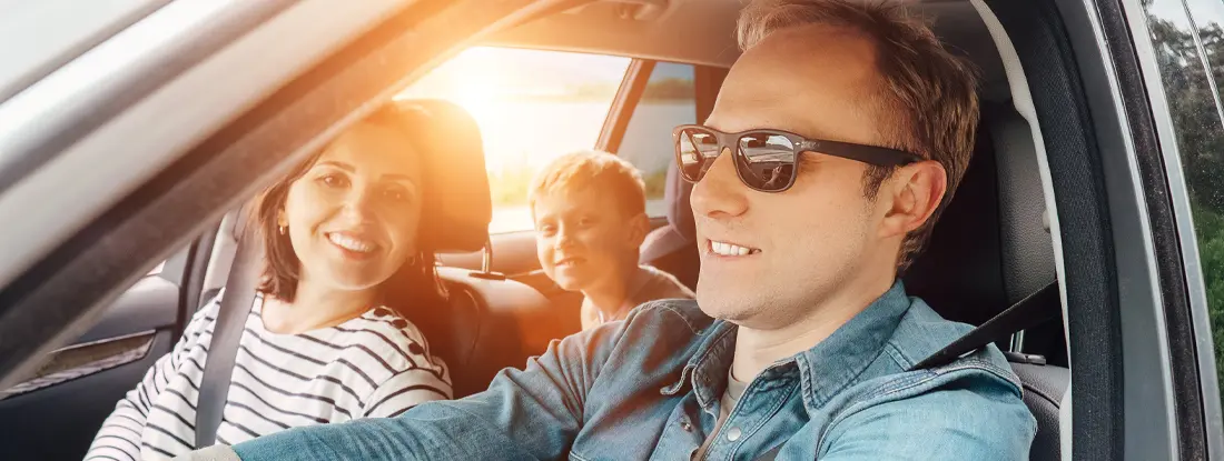 Family driving in the car. Find Lexington, Kentucky car insurance.