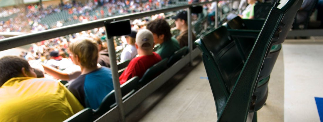 Fans at baseball game. Find Mississippi Event Liability Insurance.