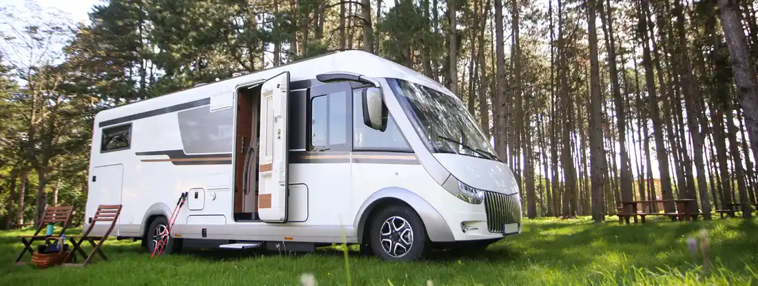 Camper van on a mountain. What Does RV Insurance Cover? 2026 Guide.