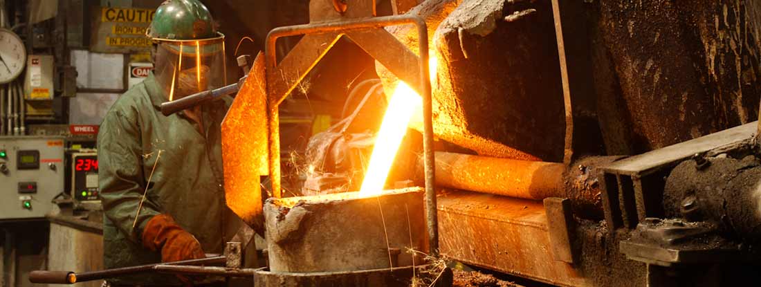 Molten steel being poured in a foundry. Should You Self-Insure Your Workers' Compensation?