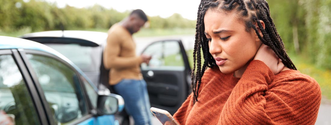 Woman on phone after a car accident. Girlfriend in Car Accident.