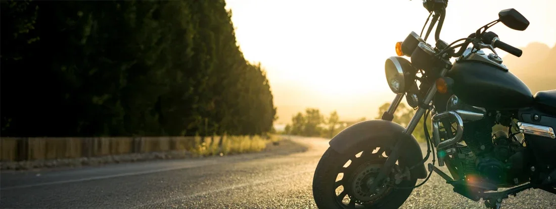 Motorcycle parked on the road. Find Motorcycle Insurance Quotes.
