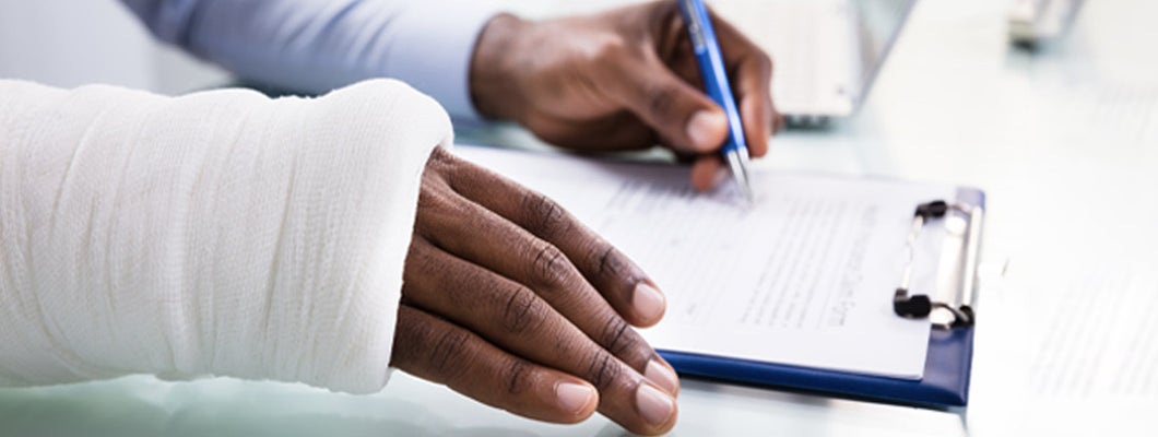Injured Man reviewing Social Security Disability paperwork. Social Security disability insurance.