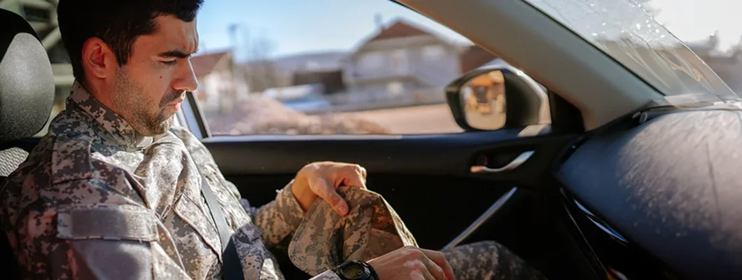 Soldier in a car coming home. Military Discounts for New Cars.