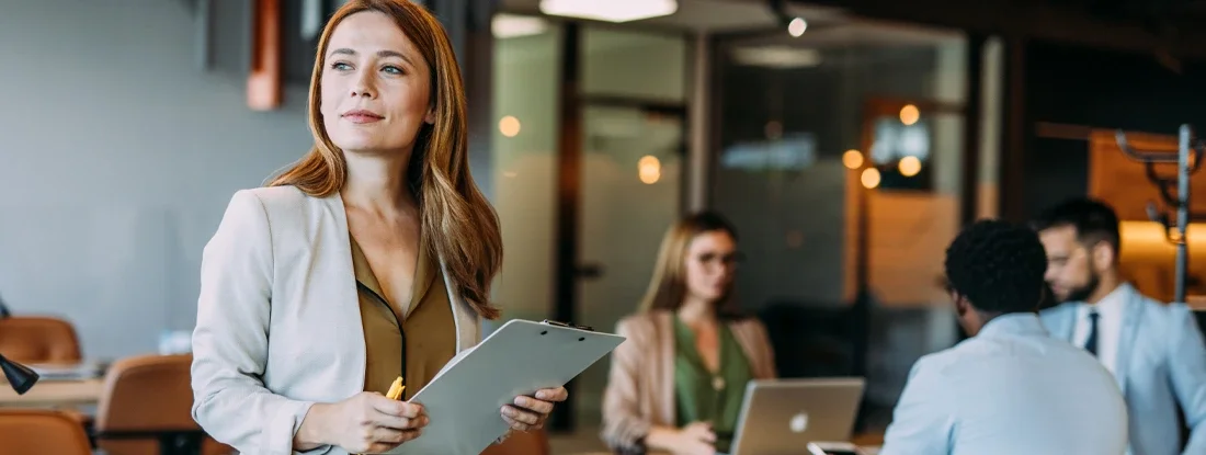 Confident businesswoman and her team. Fidelity Bond: What it Is, Cost, and Uses.
