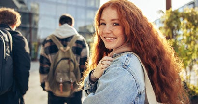 Girl going for lecture in college. A Lesson in Insurance for College Students.