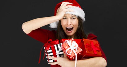 woman holding christmas gifts