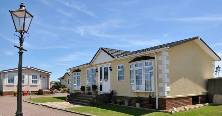 Fancy residential mobile home on beautiful property. Mobile Home Insurance Claims.