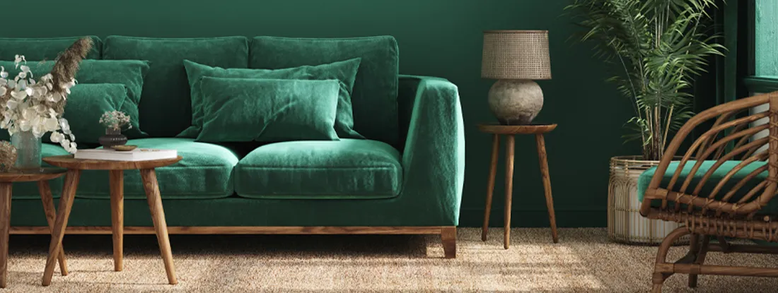 Condo interior background with green sofa, table and decor in living room. Condo Insurance Dwelling Coverage.