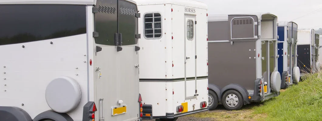 Row of horse trailers. Find New Jersey Trailer Insurance.