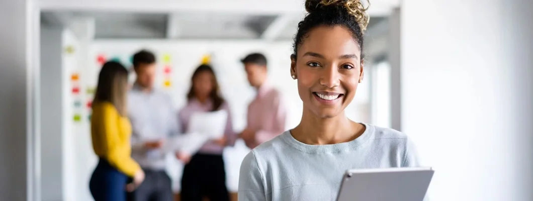 Woman working online at the office using a tablet. Business Insurance in Jericho, New York.