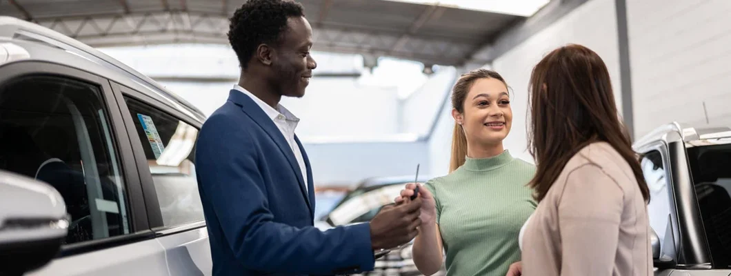 Mother and daughter buying a car in a car dealership. Can You Return a New Car?