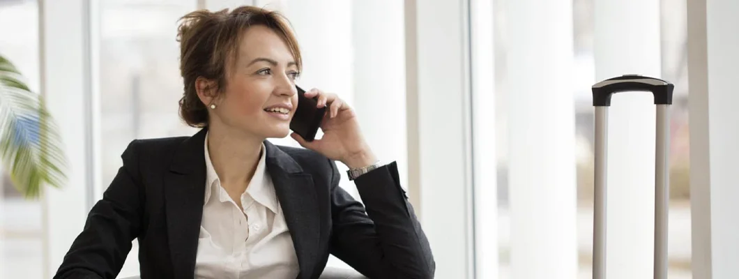 Businesswoman in an airport lounge. Find Los Alamos, New Mexico business insurance.
