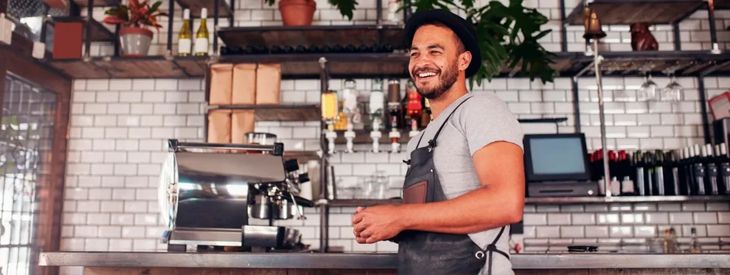 Bar owner standing at the counter. Find Long Grove, Illinois business insurance.