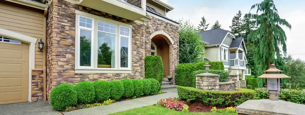 Beautiful curb appeal of American house with stone trim. St. Charles, Missouri Homeowners Insurance. 
