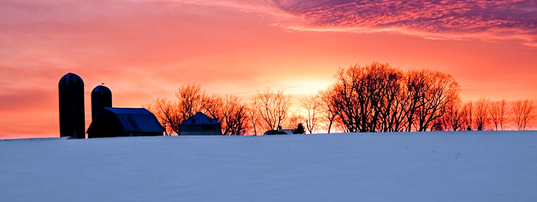 Minnesota farm in winter at sunset. Minnesota State Laws and Regs.