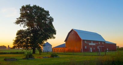 Red Barn at Sunrise. Find Farm Insurance.