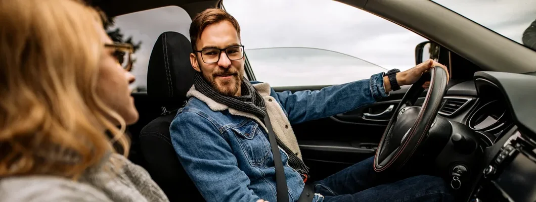 Couple enjoying an autumn ride in a countryside. How to Find the Best Car Insurance Policy in Villanova, Pennsylvania.