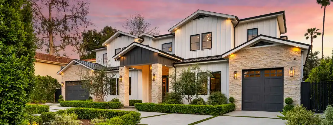 House in a charming neighborhood with stunning sidewalk landscaping. What Factors Affect Homeowners Insurance Rates?
