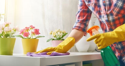 Woman cleaning a house. 