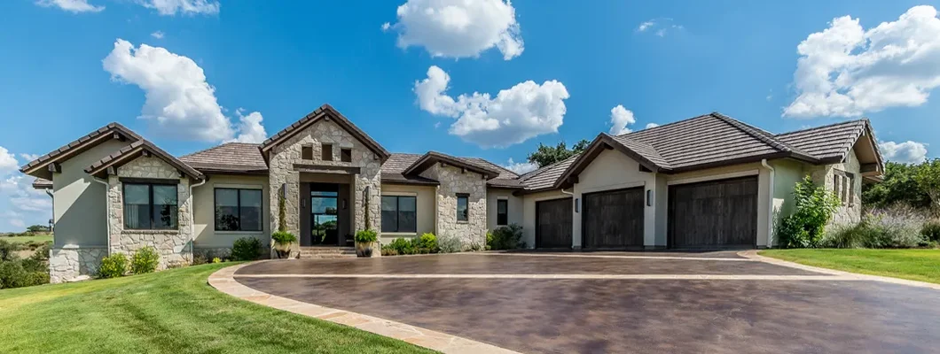 Decorated concrete on driveway of new home. How to Find the Best Homeowners Insurance in Cumberland Hill, Rhode Island.