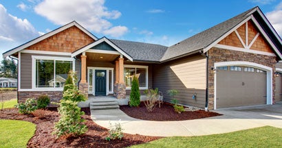 Large modern house with stone and walkway. New homeowners in Massachusetts avoid making these 5 mistakes.