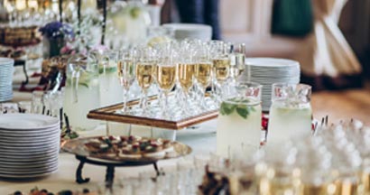 stylish champagne glasses and food appetizers set up by catering business