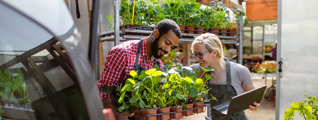 Garden center workers transporting plants in a van. Find Colorado Commercial Vehicle Insurance.