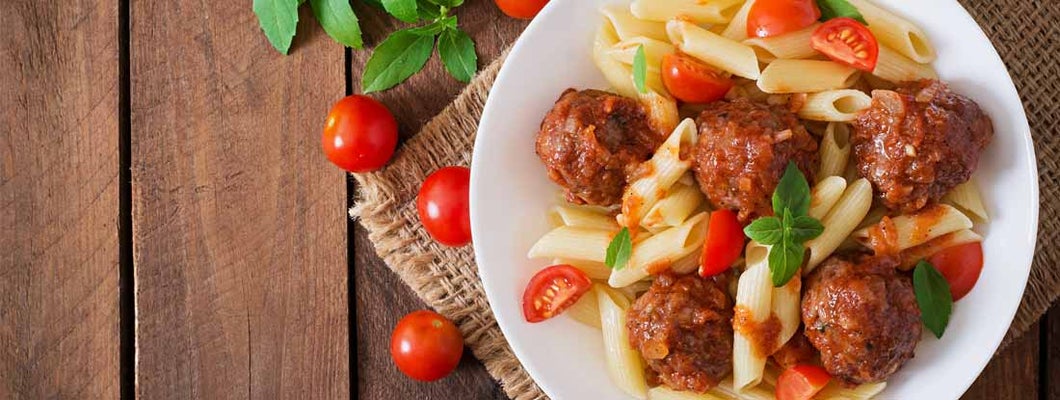 Penne pasta with bison meatballs in tomato sauce