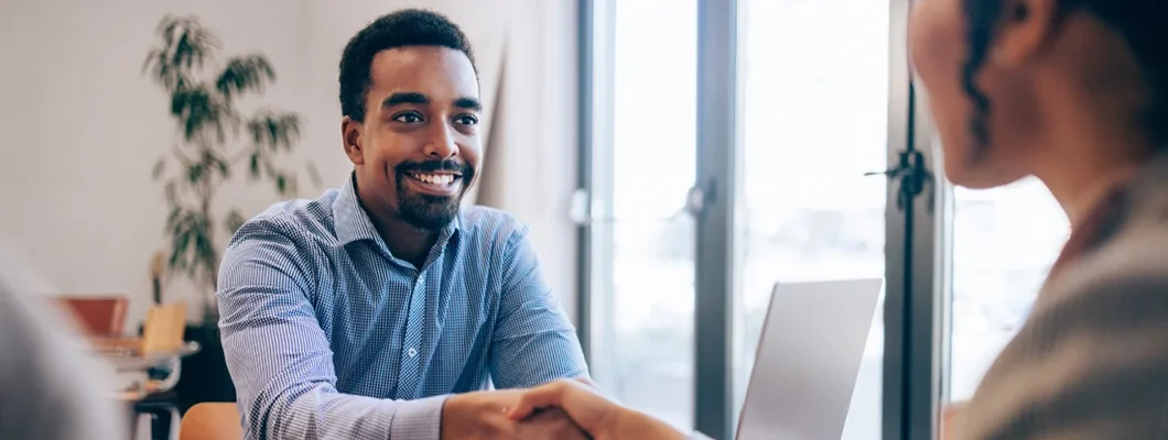 Handshake at a Job Interview. How Do Insurance Agents Make Money?