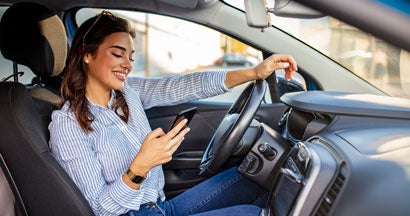Woman is texting in a traffic jam. Can you get a citation for texting at a stop light in your state.