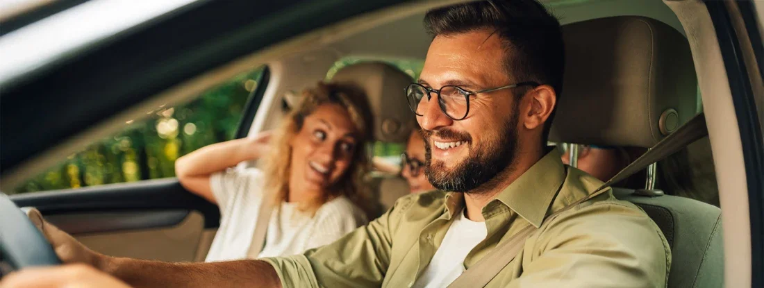 Father driving a car to spend a weekend with his family. What Is Full Coverage Car Insurance?