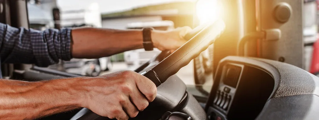 Commercial Driver Inside His Truck. Louisiana Commercial Vehicle Insurance.