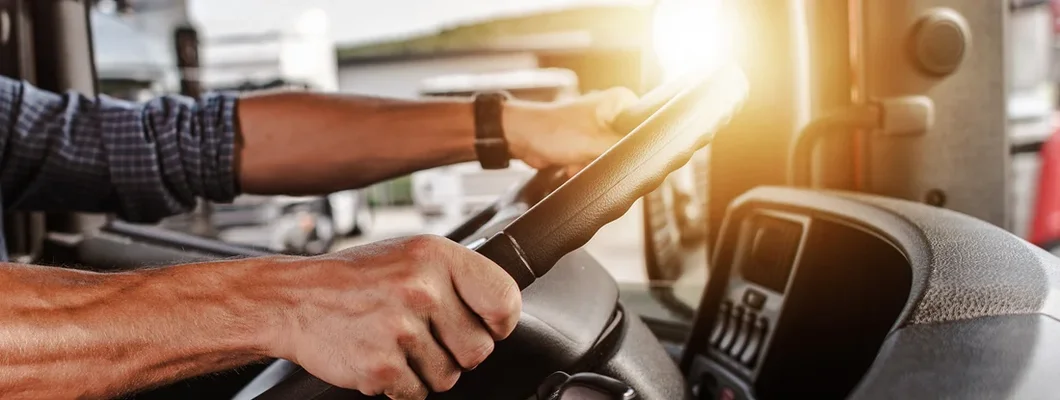 Commercial Driver Inside His Truck. Louisiana Commercial Vehicle Insurance.