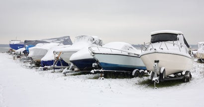 Boats on trailers in snow. Does Boat Insurance Cover Winter Storm Damage?