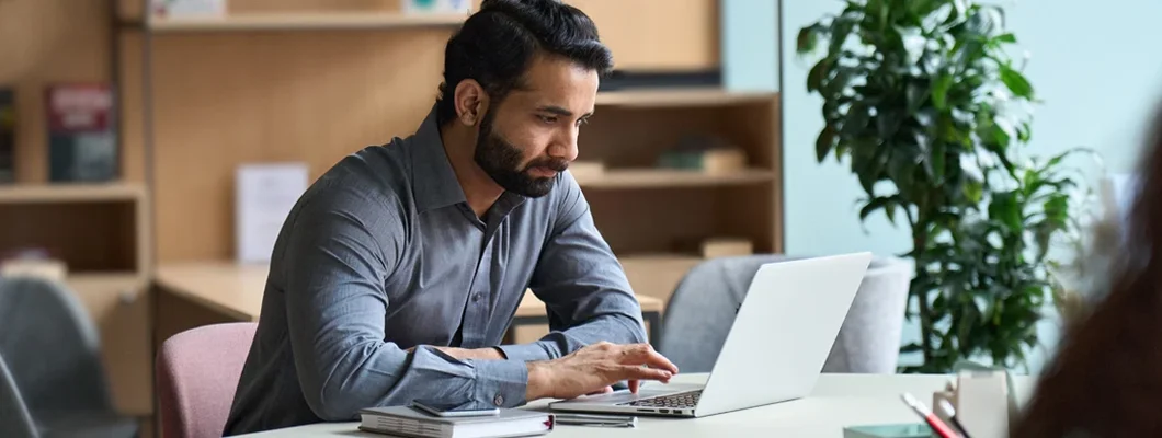 Man working on laptop at home office. Compare Landlord Insurance.