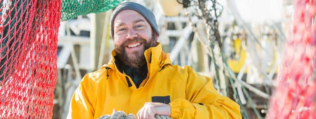 Man working on commercial fishing vessel. Find Juneau Alaska business insurance.