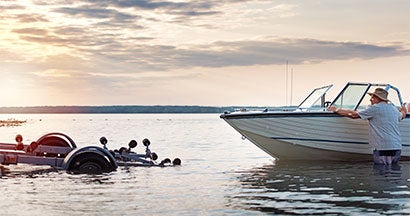 man unloading his boat from his trailer