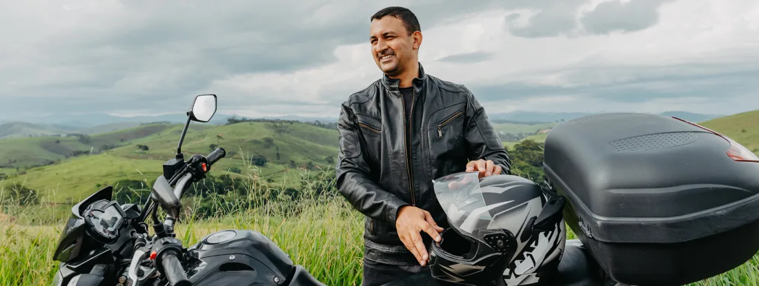 Motorcyclist enjoying the countryside view. How to File Motorcycle Insurance Claims.