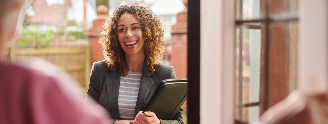 Landlord visiting renter living apartment. Find Kentucky Landlord Insurance.