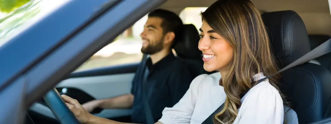 Cheerful couple traveling together. How to Find the Best Car Insurance Coverage in Ridgewood, NJ.
