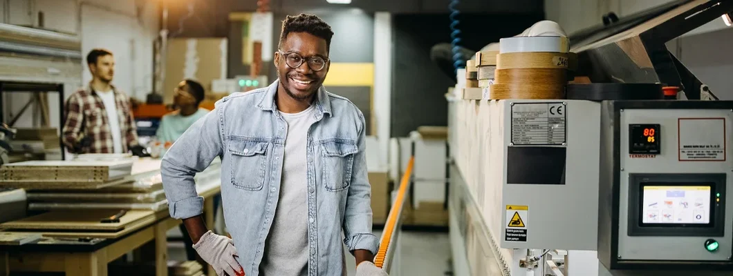 Professional carpenter posing in workshop while working late. How to Find the Best Business Insurance in Camas, Washington.