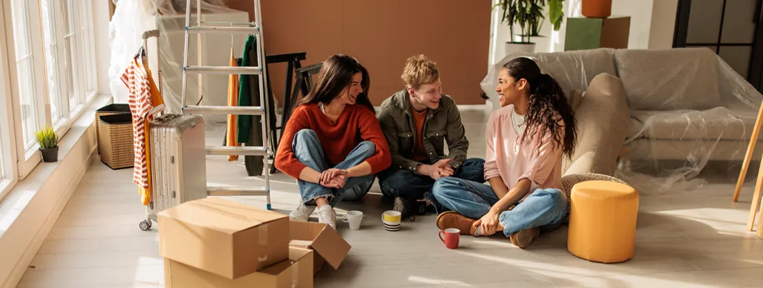 Roomates Enjoying Coffee Amidst Moving Boxes. Does Each Roommate Need Renters Insurance in 2026?