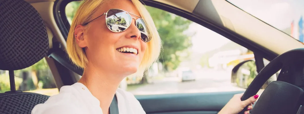 Young Woman Driving Car. How to Find the Best Car Insurance Policy in Carrington, ND.